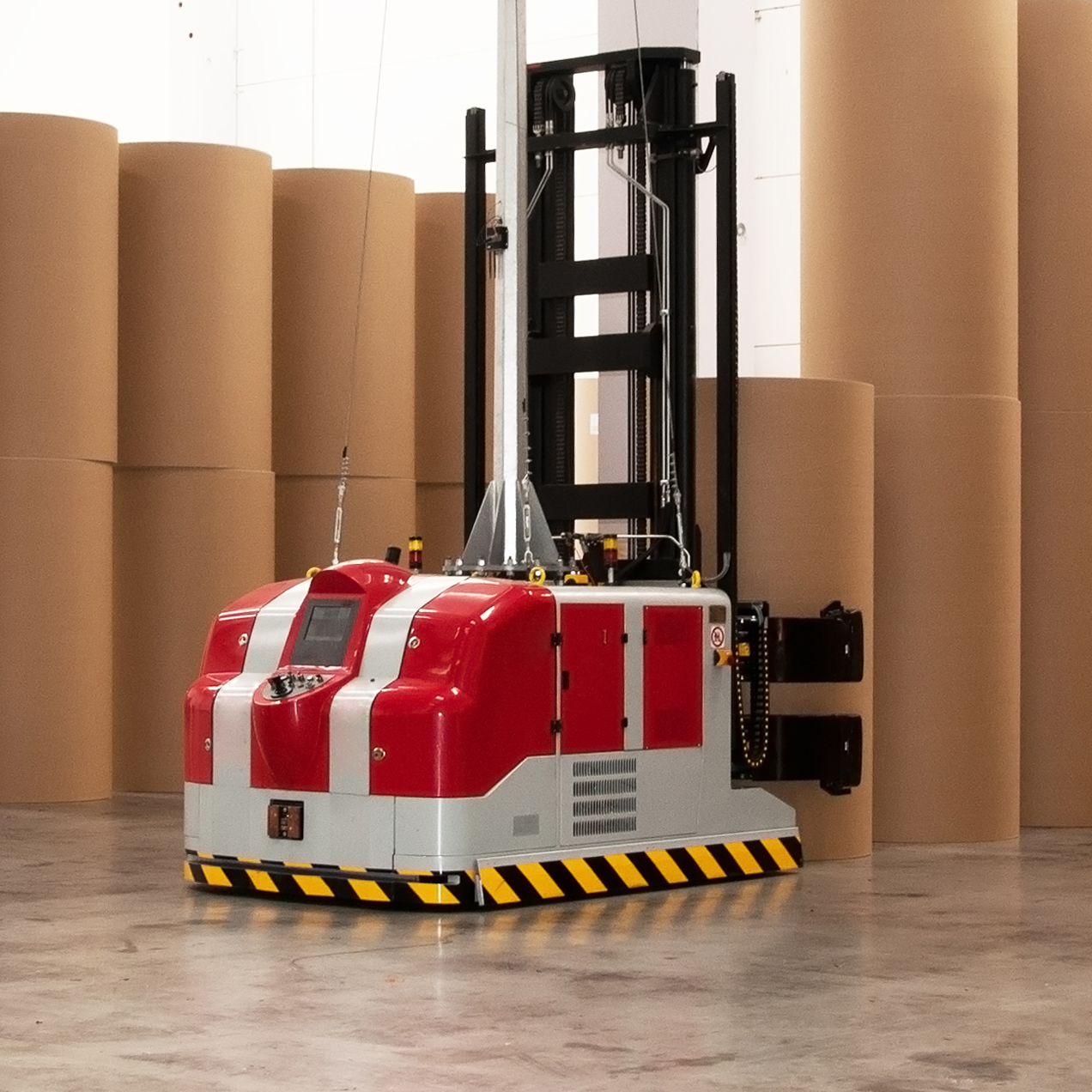 Automated warehouse (paper and cardoboard) with robotic forklift in paper mill. This paper mill is a factory devoted to making paper and cardboard from recycled paper  using a Fourdrinier Machine.